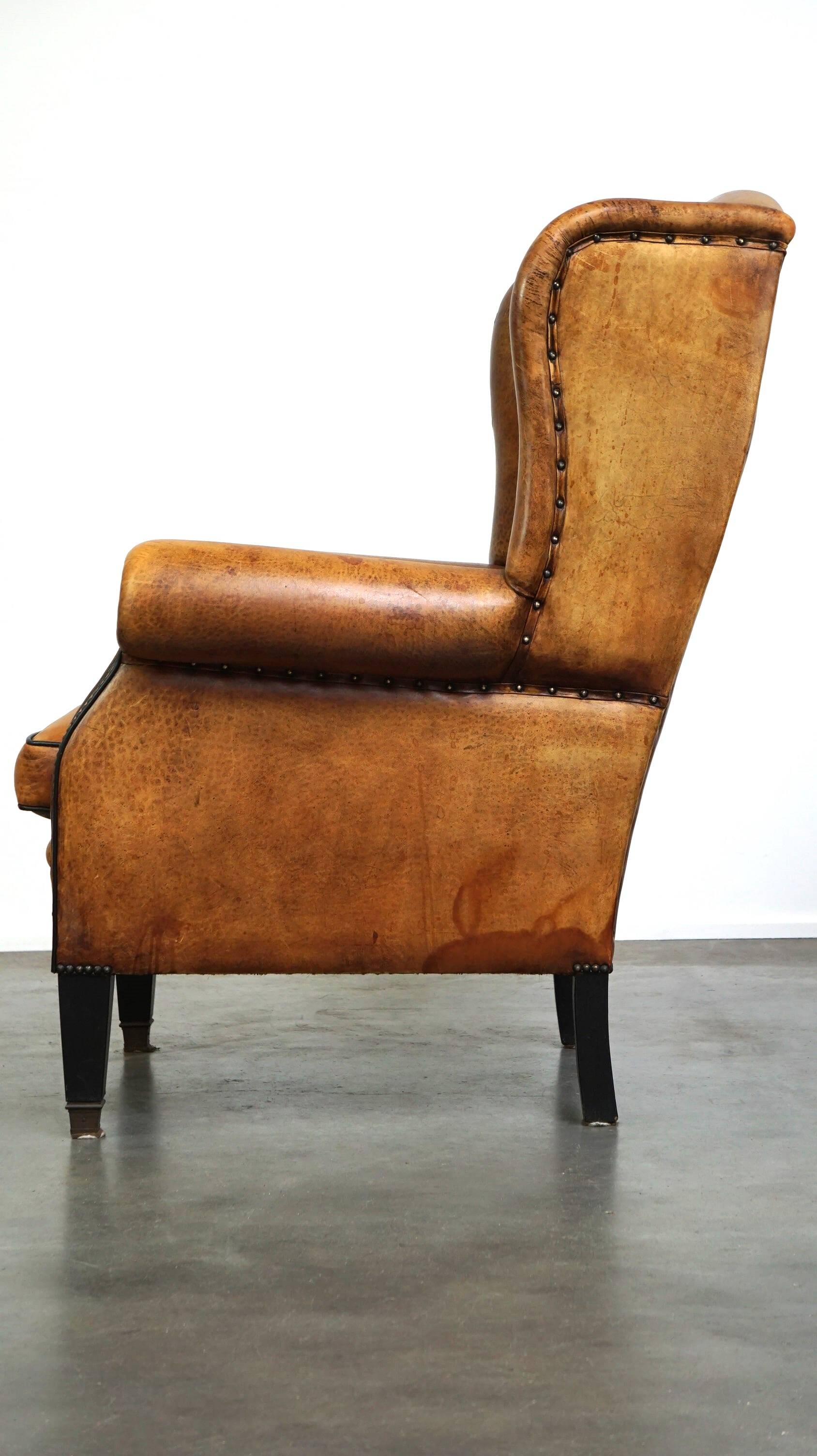 Sheepskin leather chair with a beautiful patina