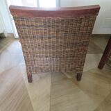 2 colonial-style armchairs in woven rattan and exotic wood