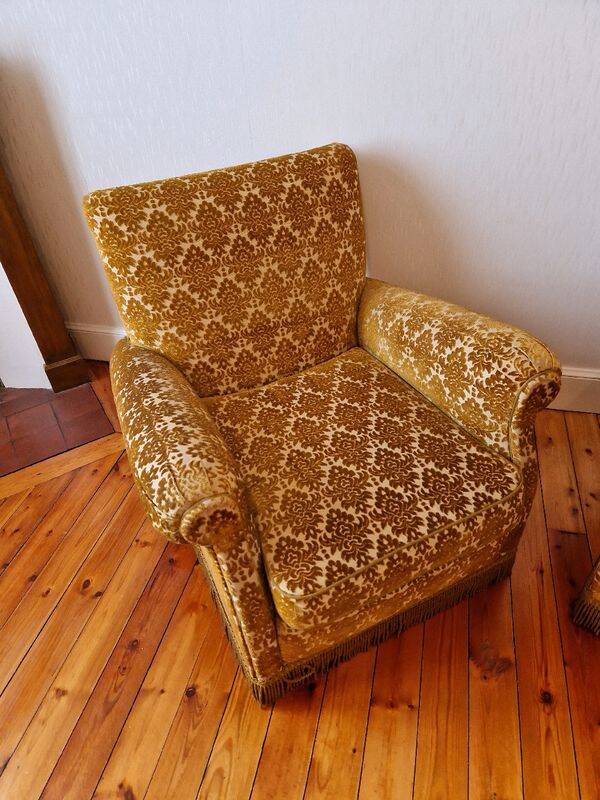 Pair of golden fringed armchairs