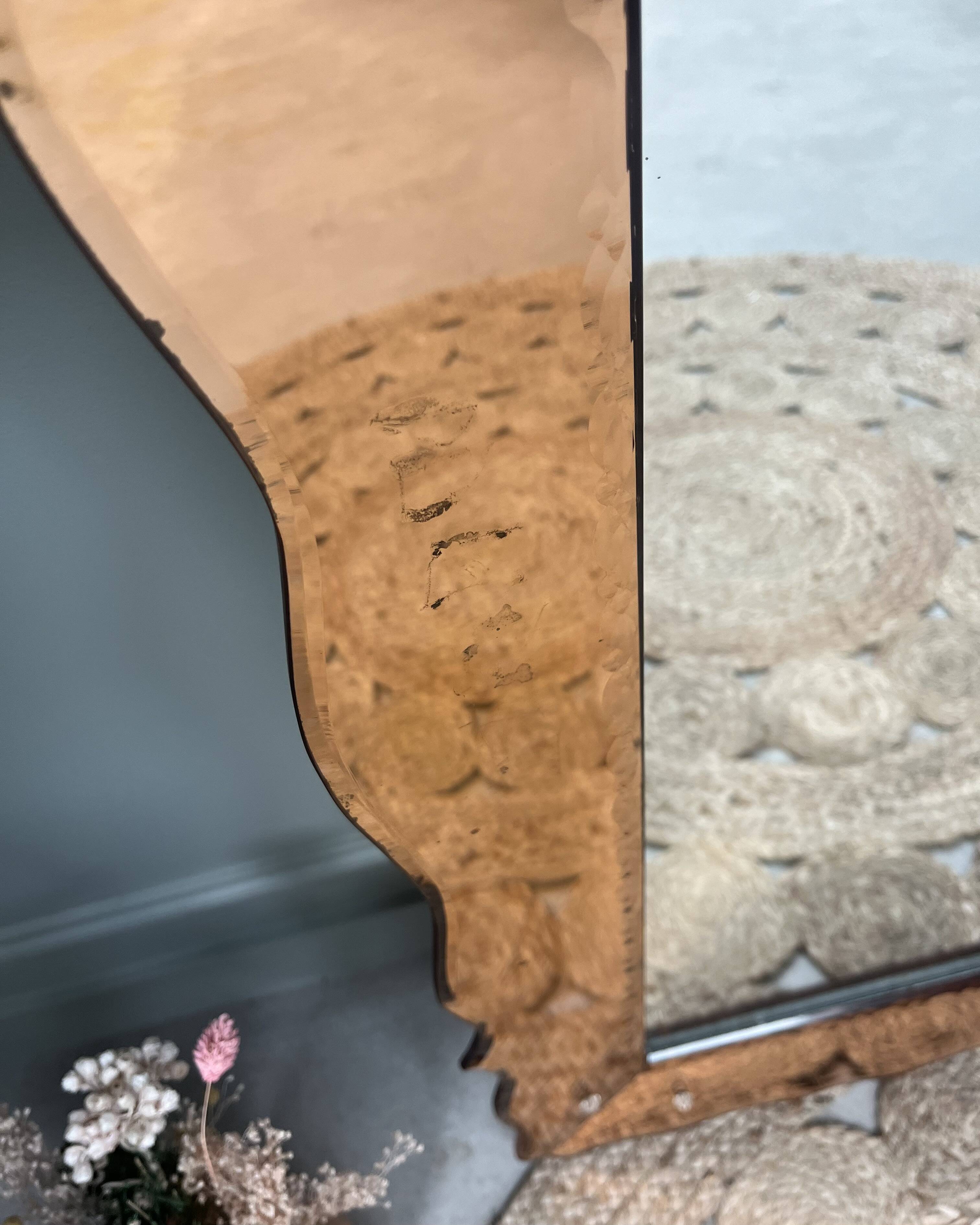 Large pink Venetian mirror