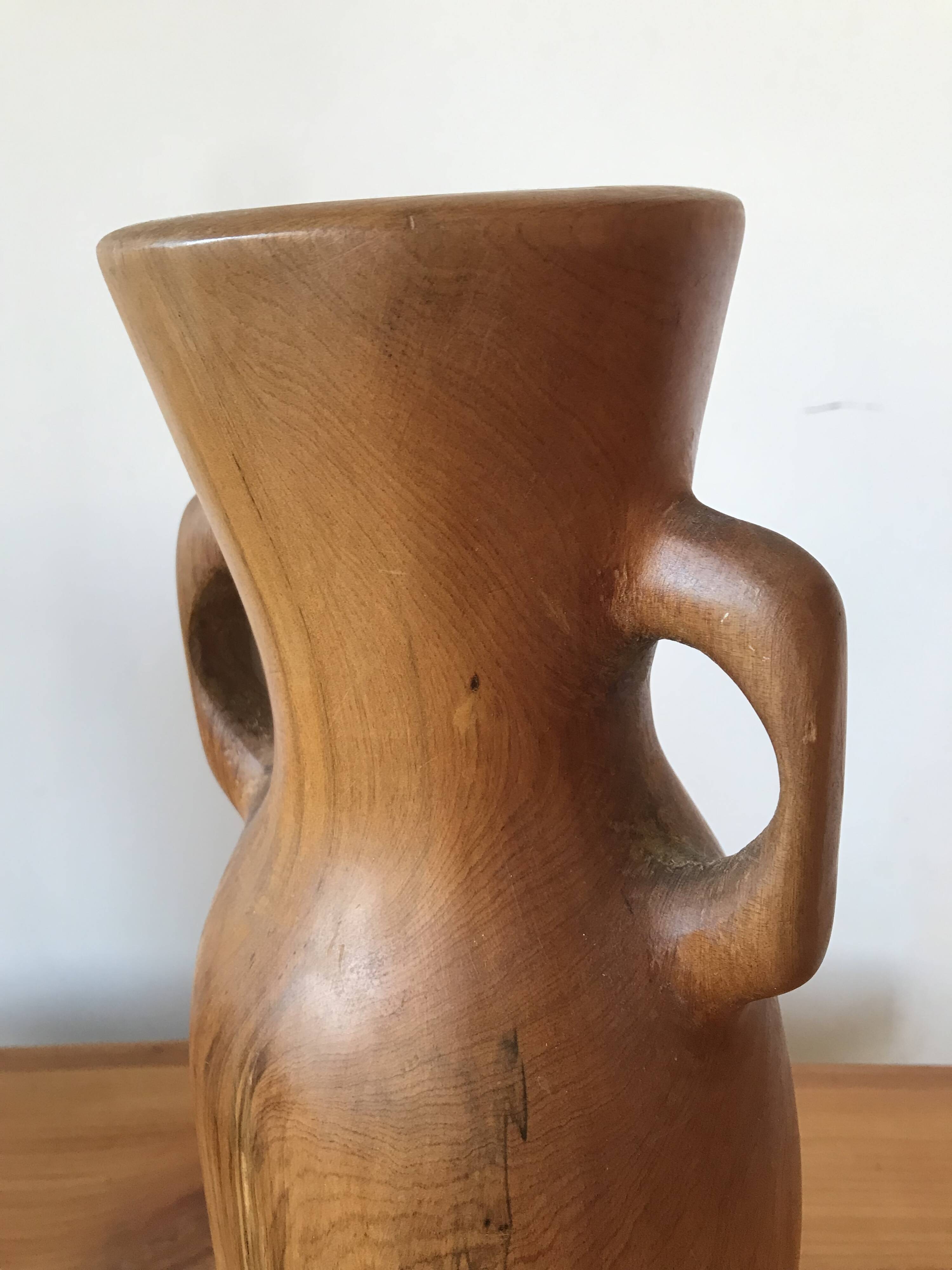 Olive wood flower vase.