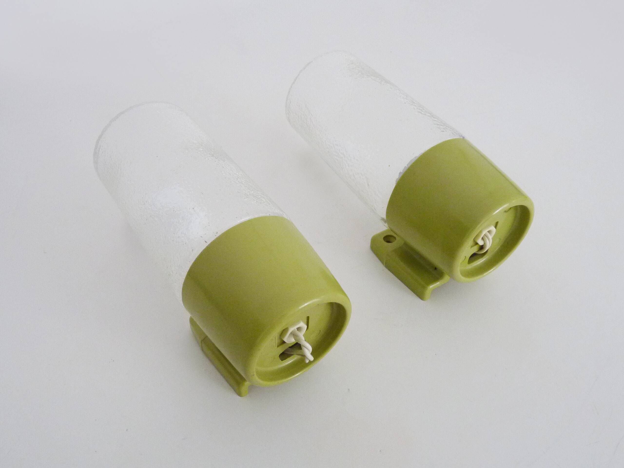 Pair of vintage pop wall lights in pastel green PVC and glass globe. 70s