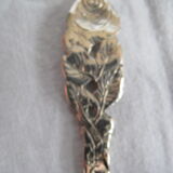 silver metal sugar and silver sugar spoon.