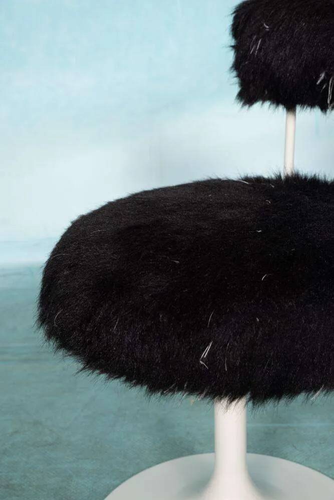 Space age design armchair from the sixties, fluffy stool with trumpet base.
