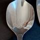 Silver-plated metal serving spoon and French fry shovel signed "Wiskmann"