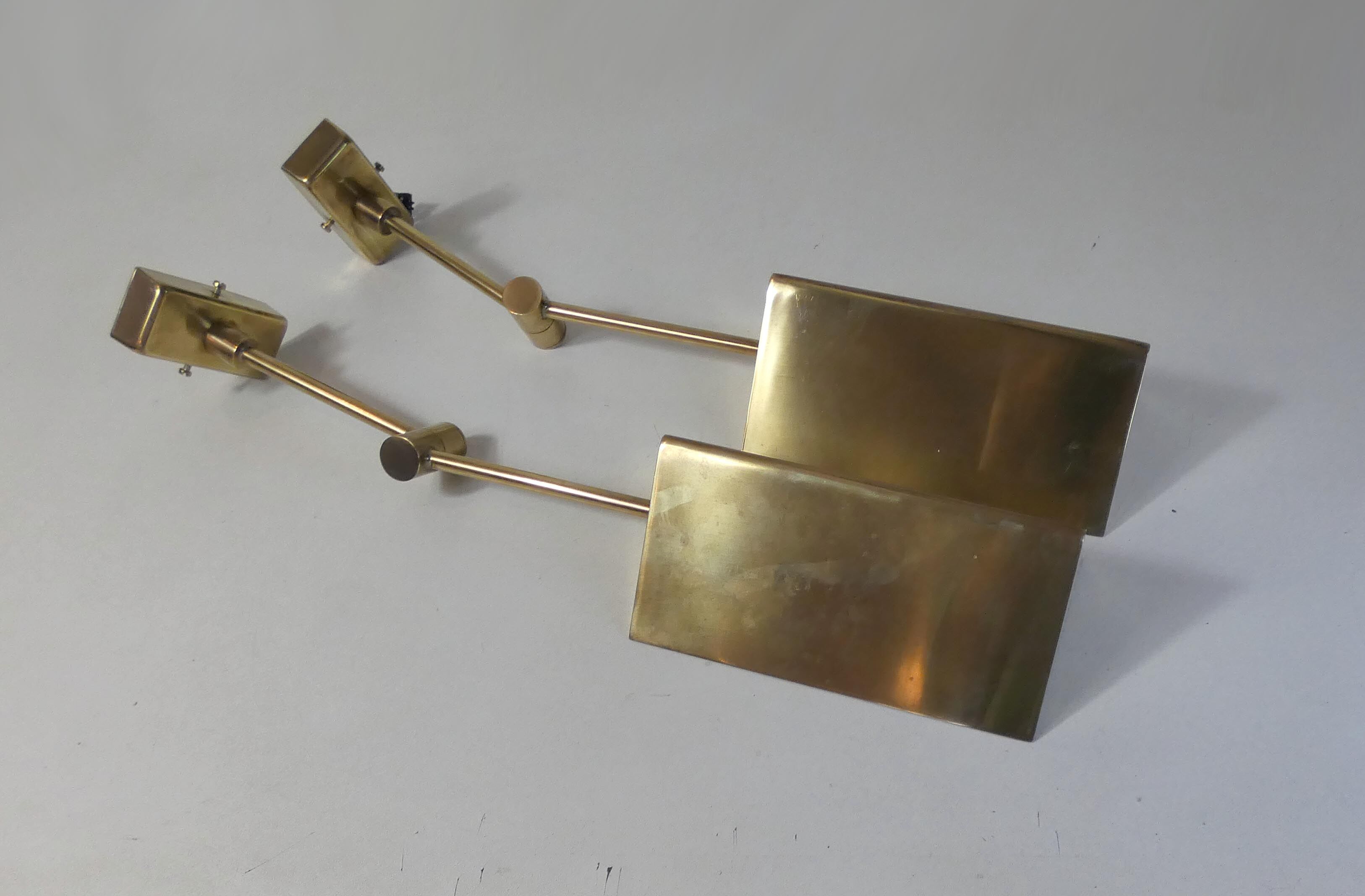 Pair of adjustable brass wall lamps after koch & lowy