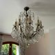 Lustre with 10 arms of light, antique with crystal pendants.