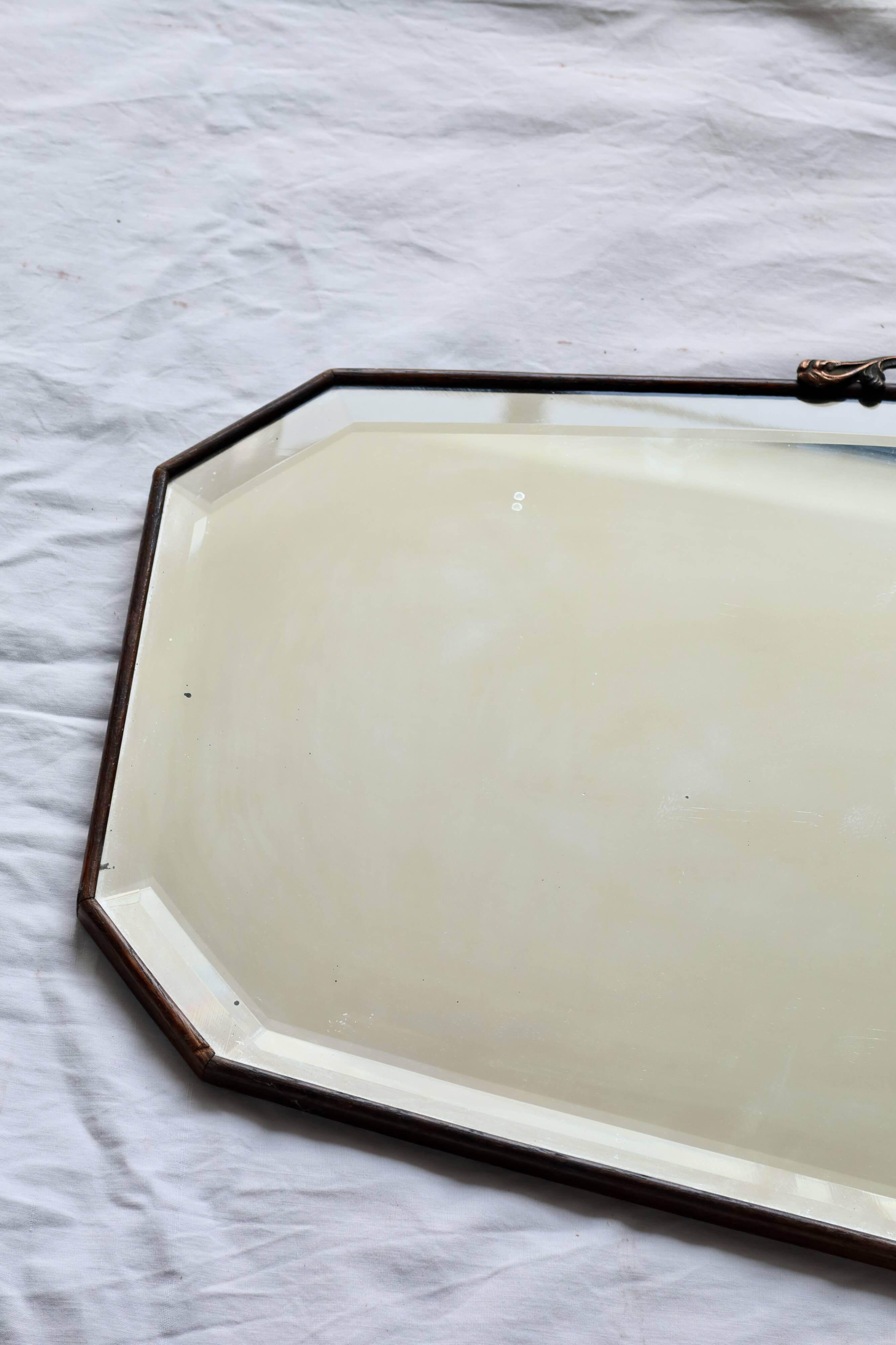 Large antique beveled mirror – dark wood and decorative bronzed metal knot