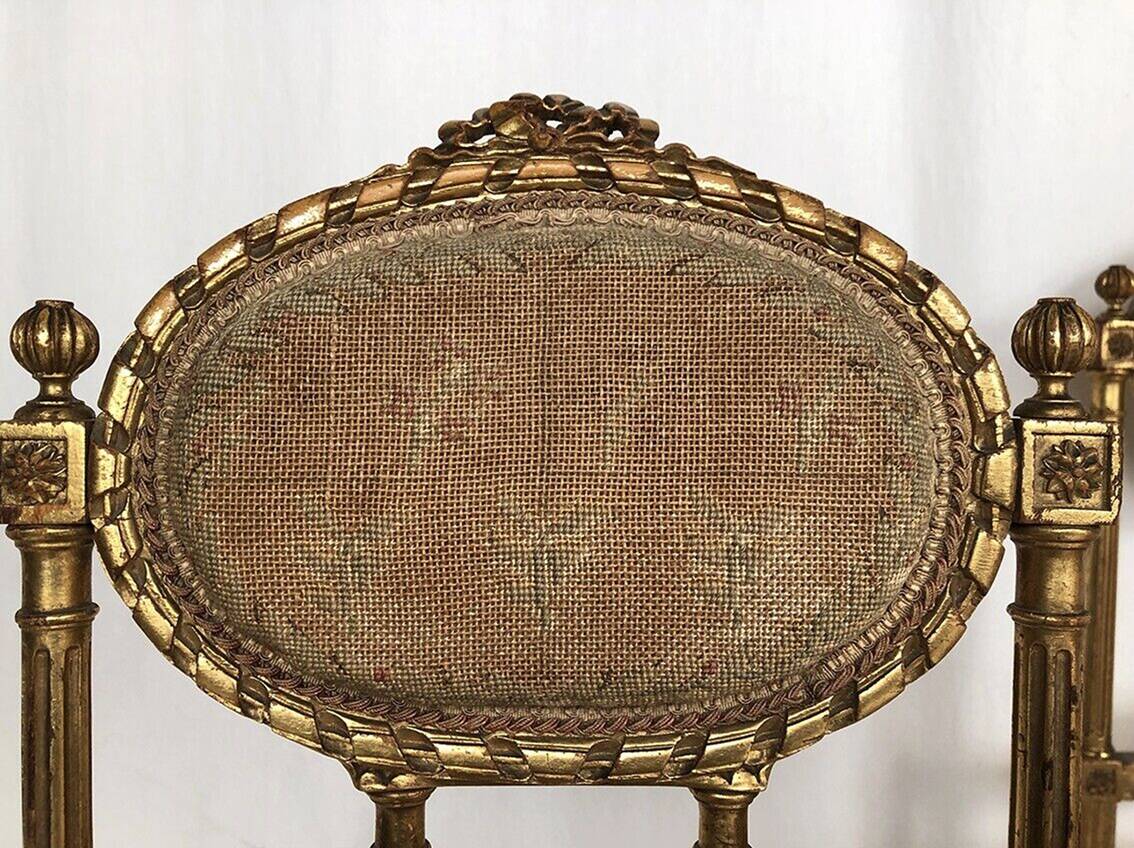 Series of three Louis XVI style chairs in gilded wood, circa 1900