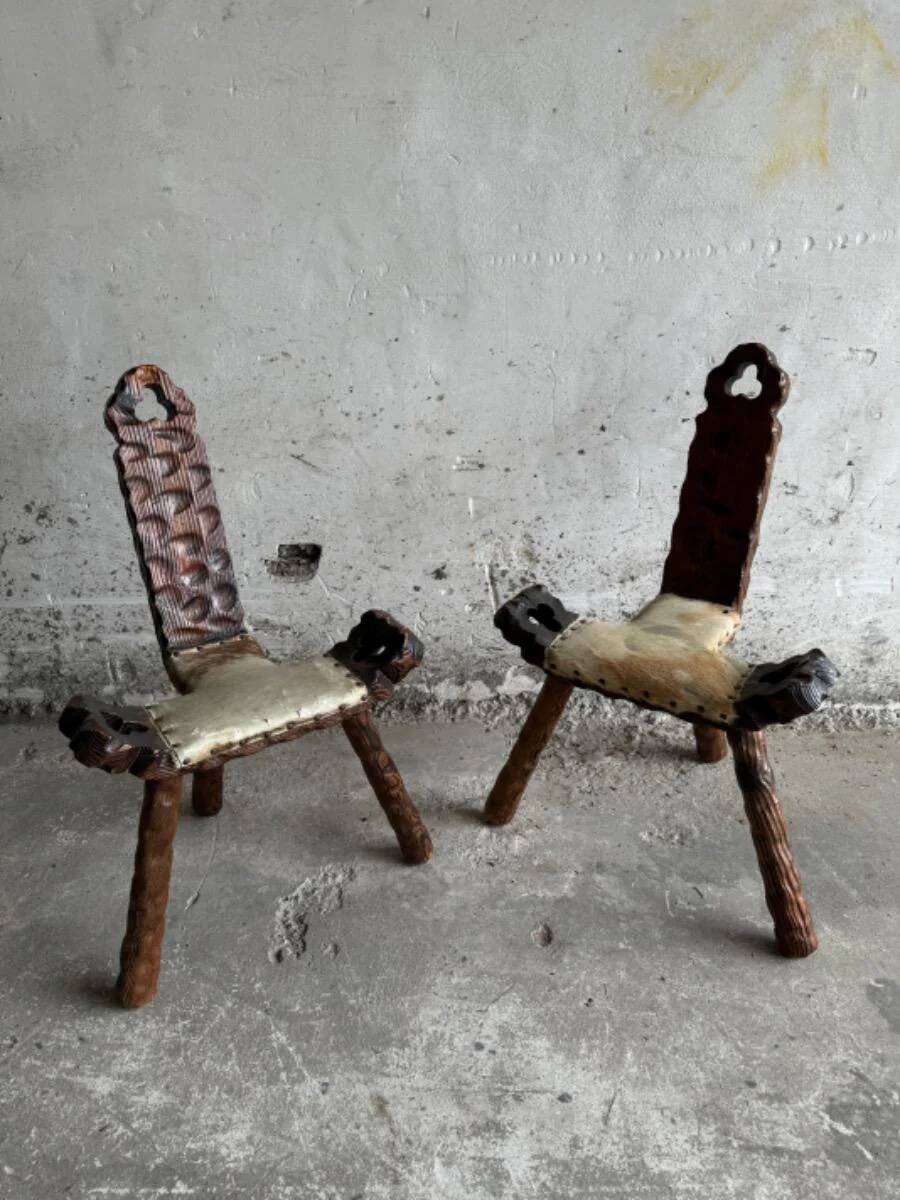 Pair of 1950s Spanish carved solid wood chairs with beige cowhide leather seats