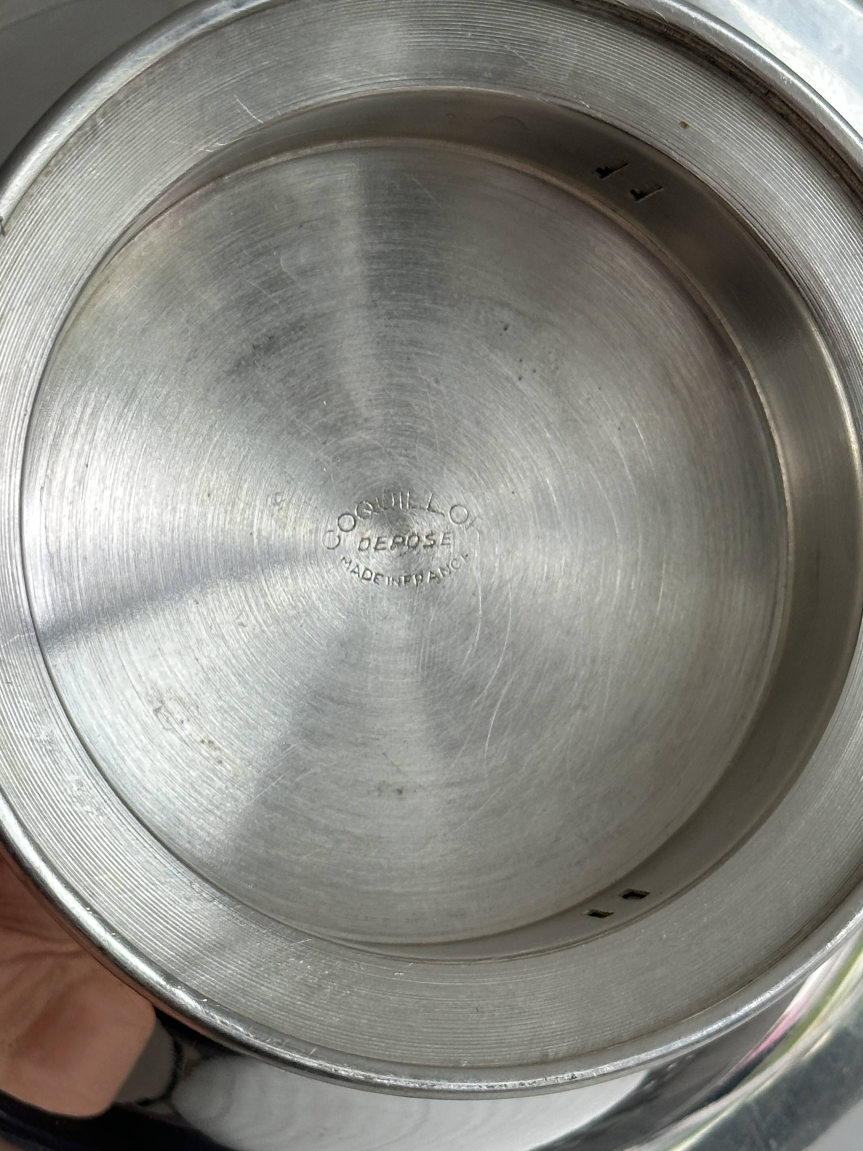 Antique shell butter dish in shiny silver metal