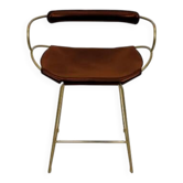 Contemporary sculptural bar stool with a metal back in aged brass and cognac leather.
