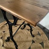 Bistro table with iron legs and raw wood top
