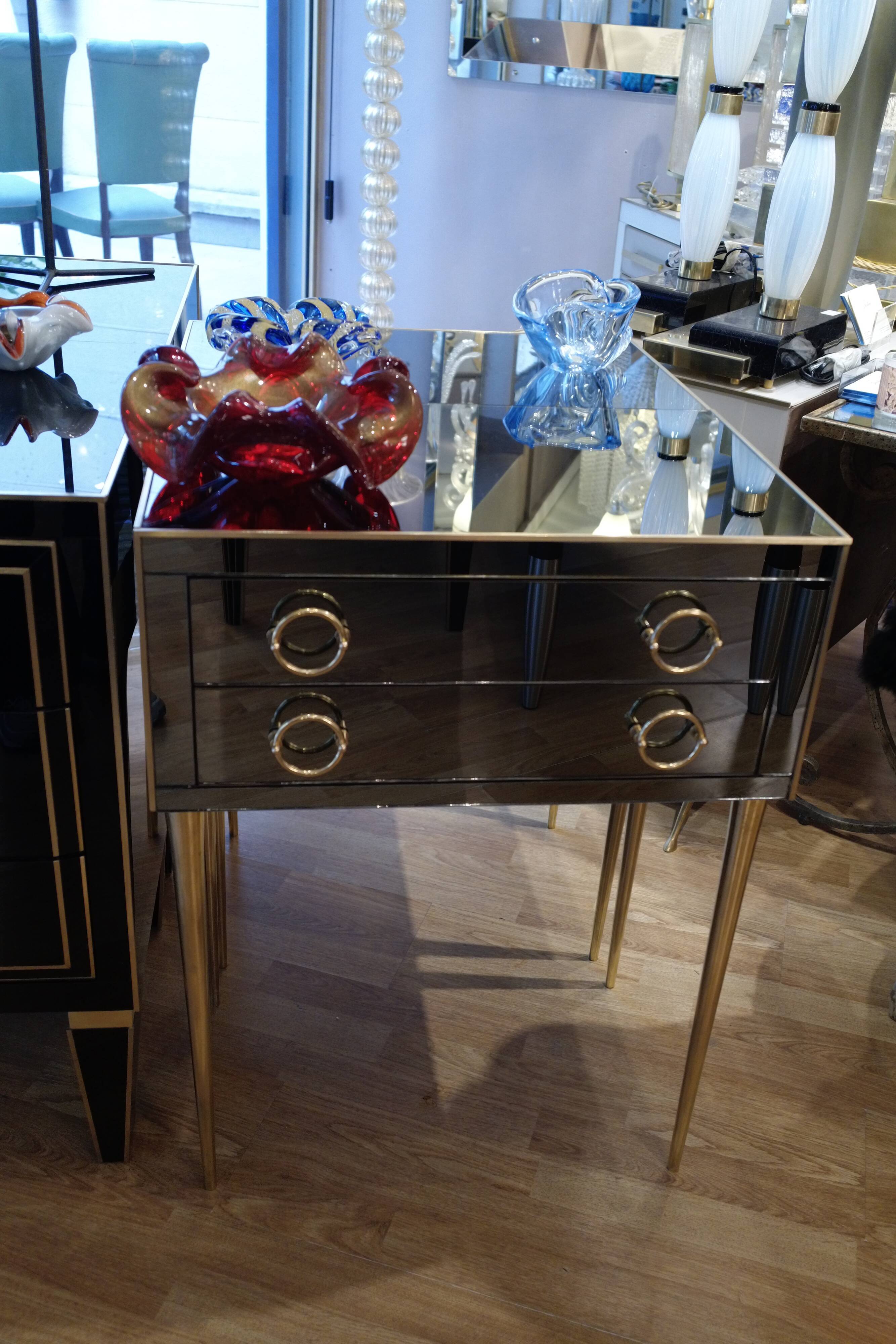 Pair of nightstands in anthracite colored glass and brass