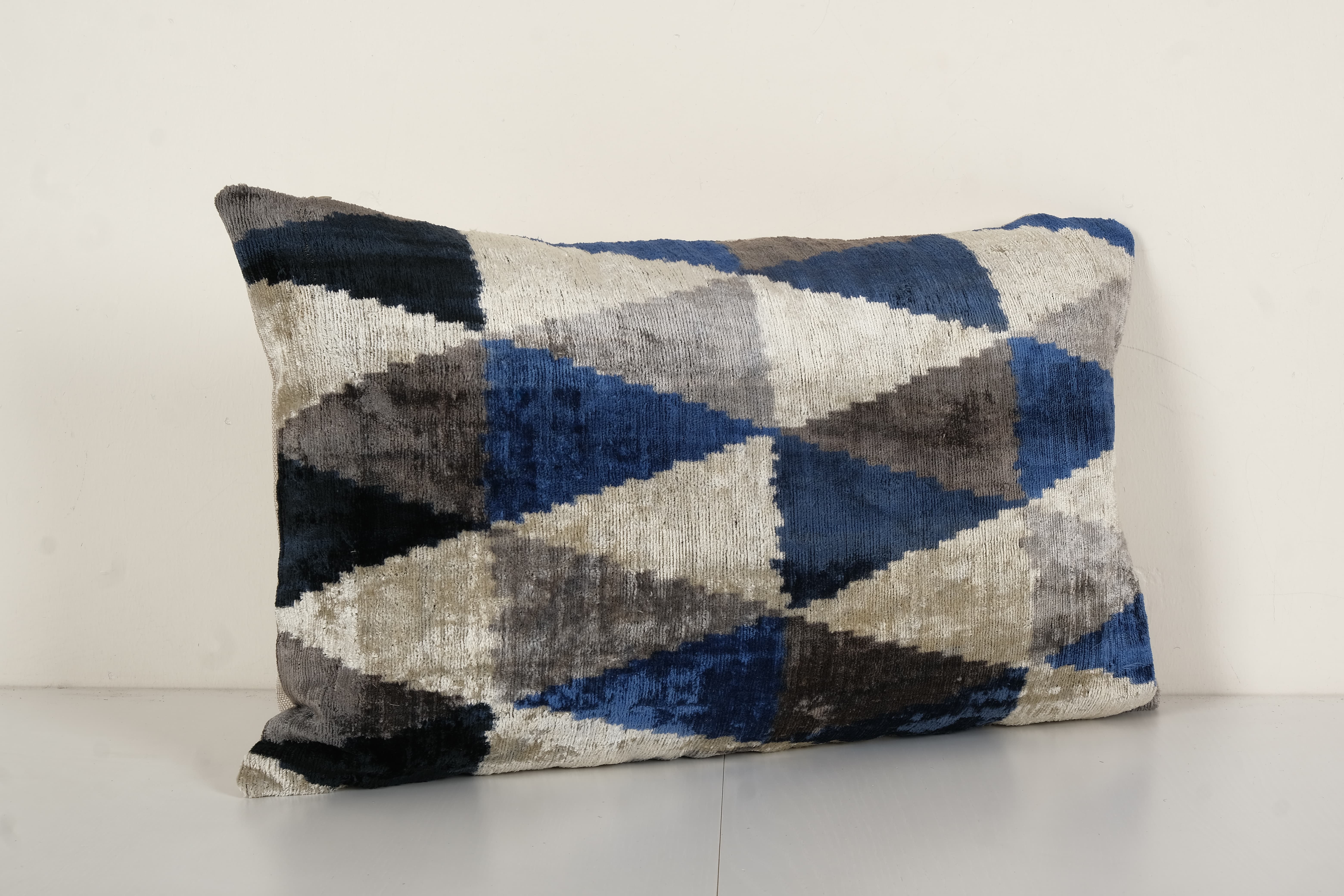 Geometric ikat velvet lumbar pillow