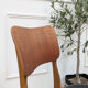 Set of 4 Danish chairs in teak and black faux leather, 1960s.