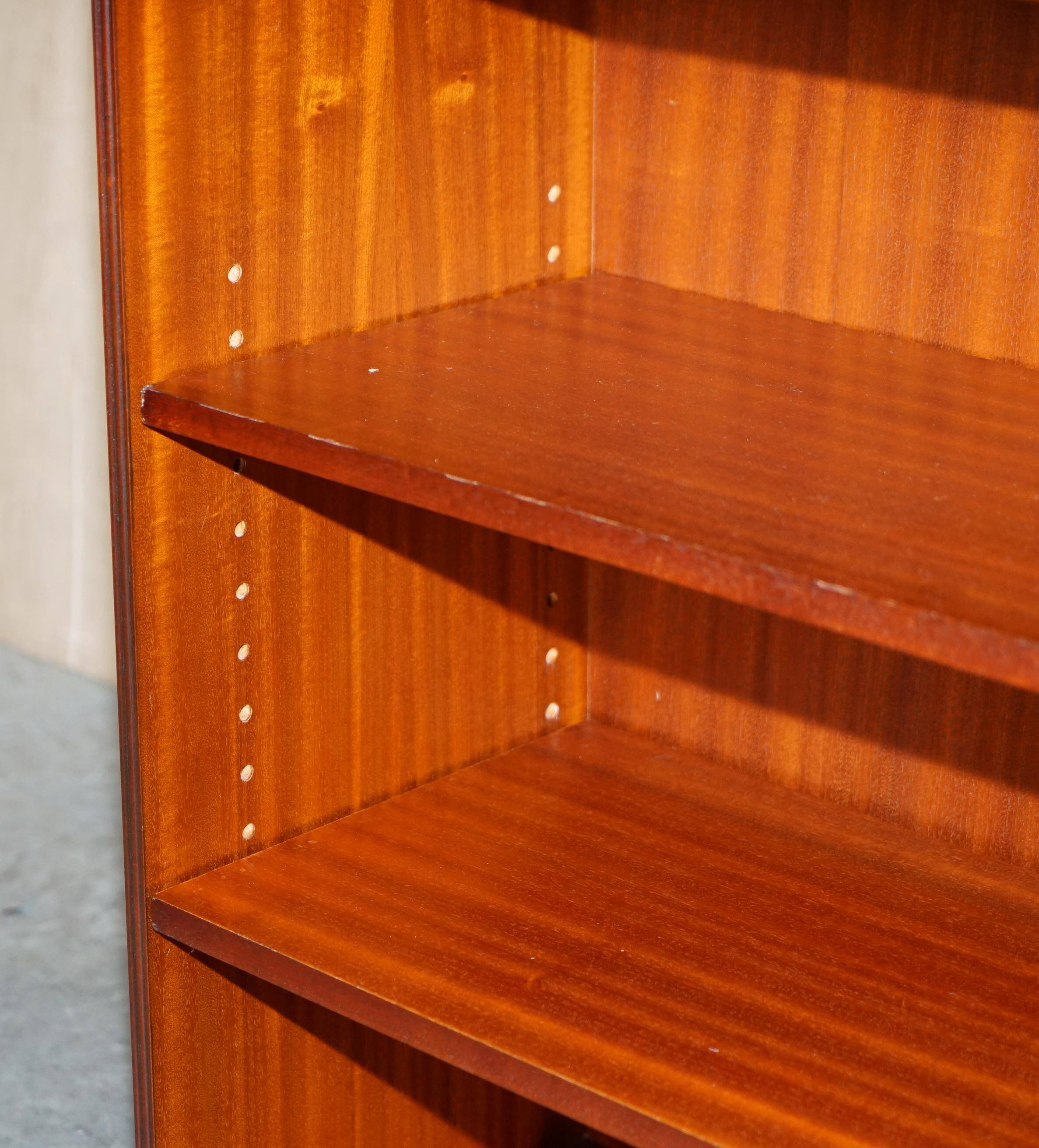 Pair of open low bookshelves Shaws of London in hardwood.