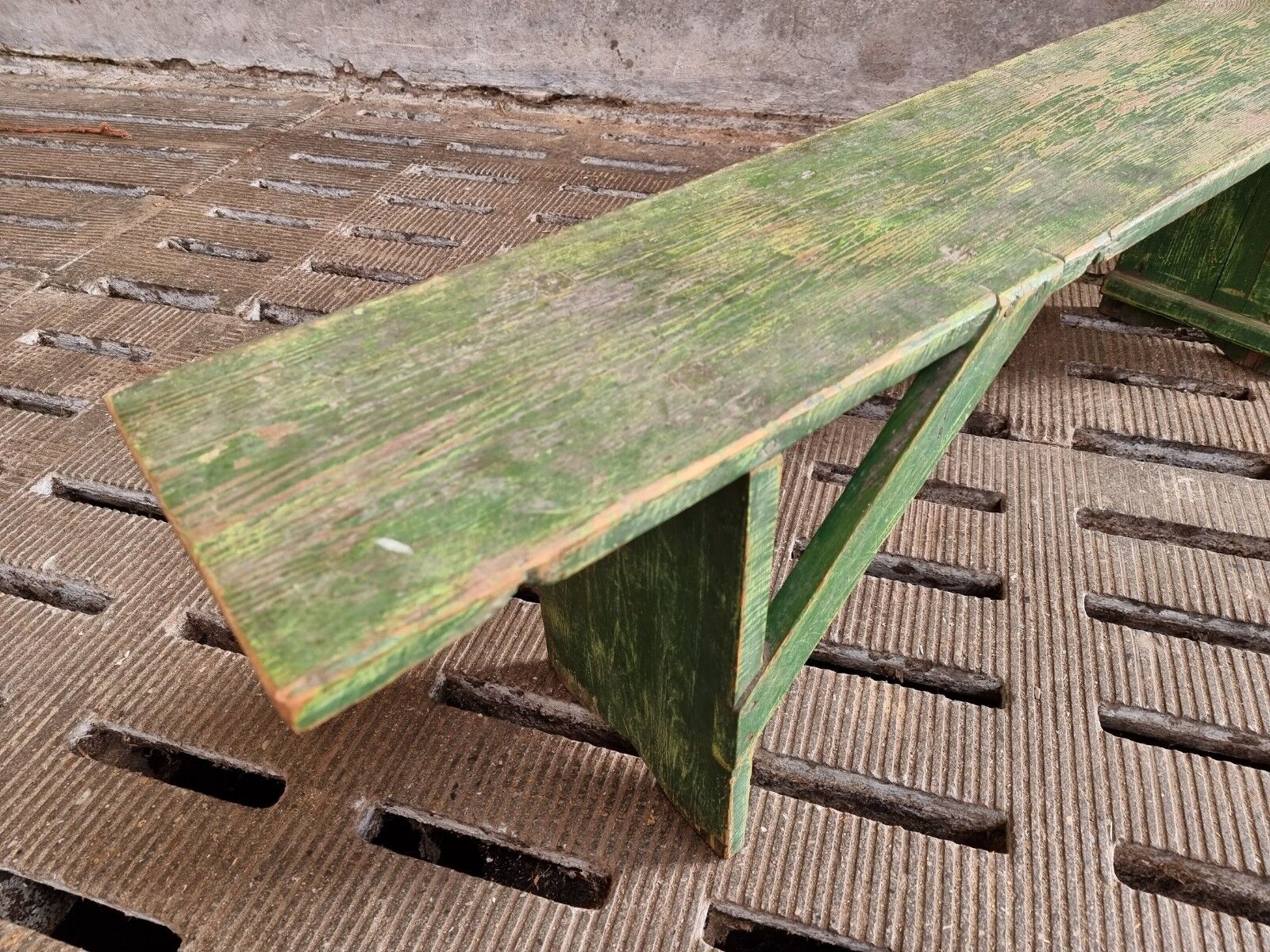 Old wooden bench side table grass green