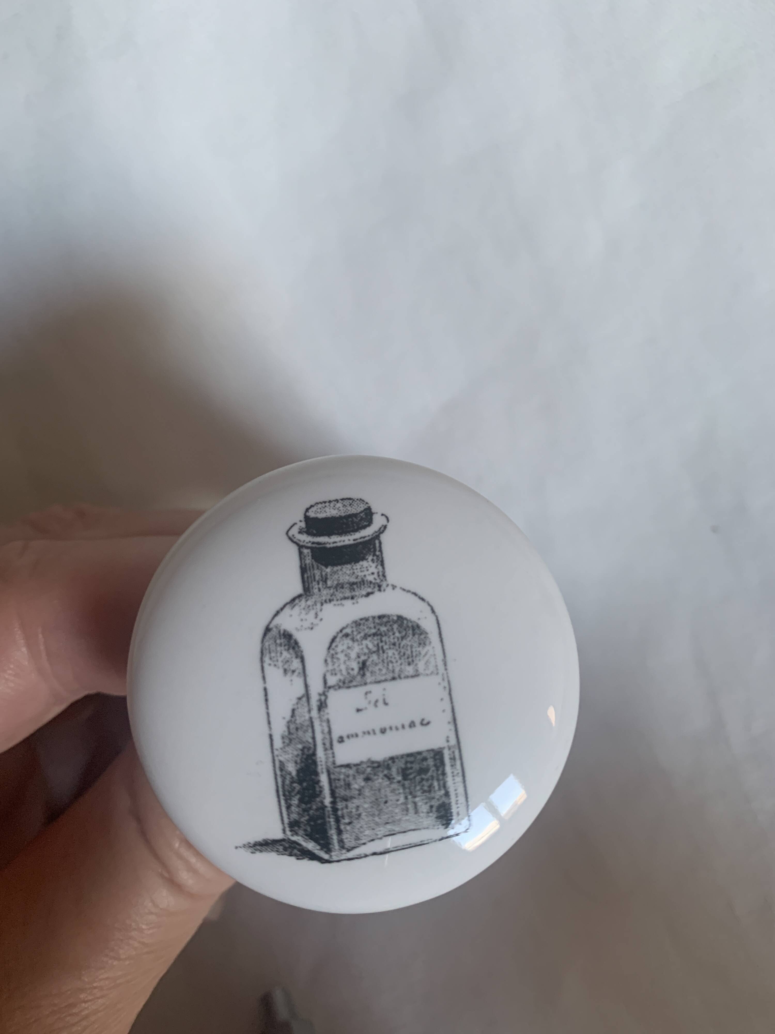 white ceramic door knobs with illustration