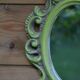 Small green wooden mirror
