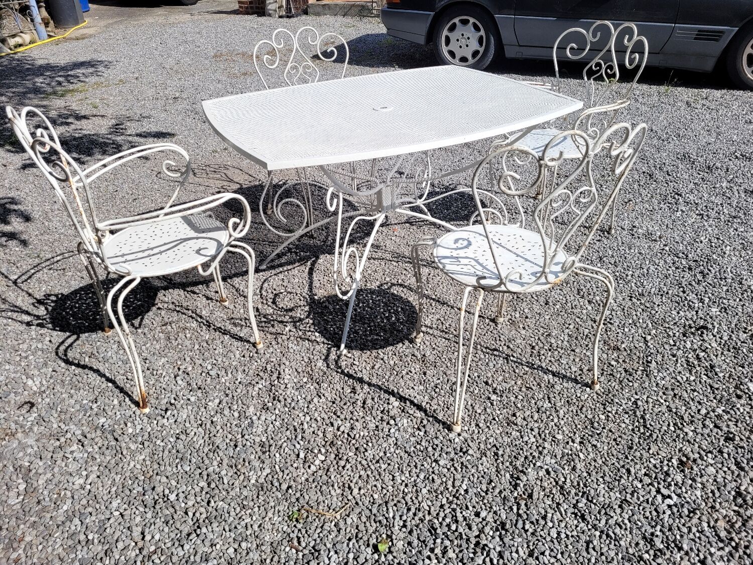 Old wrought iron garden furniture, table + 2 armchairs + 2 chairs