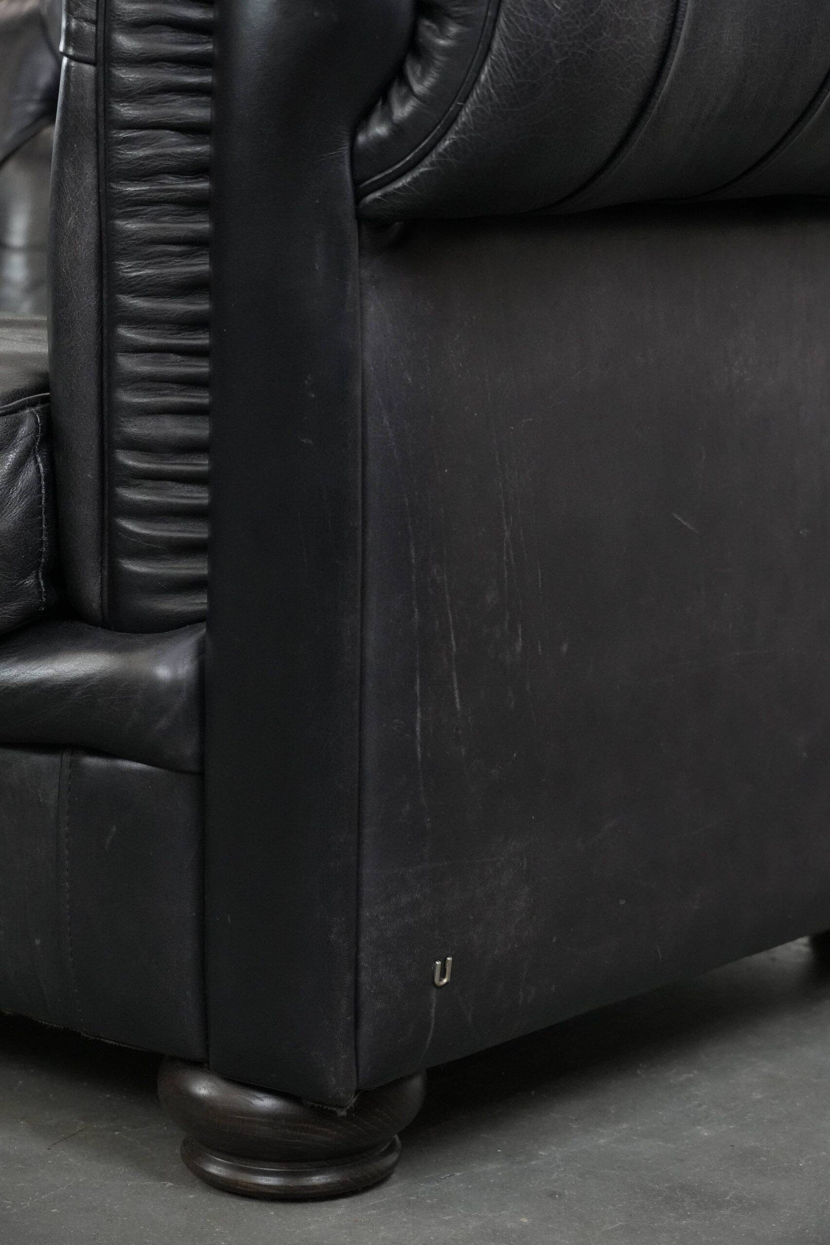Black chesterfield 3-seater sofa made of cowhide leather in English style