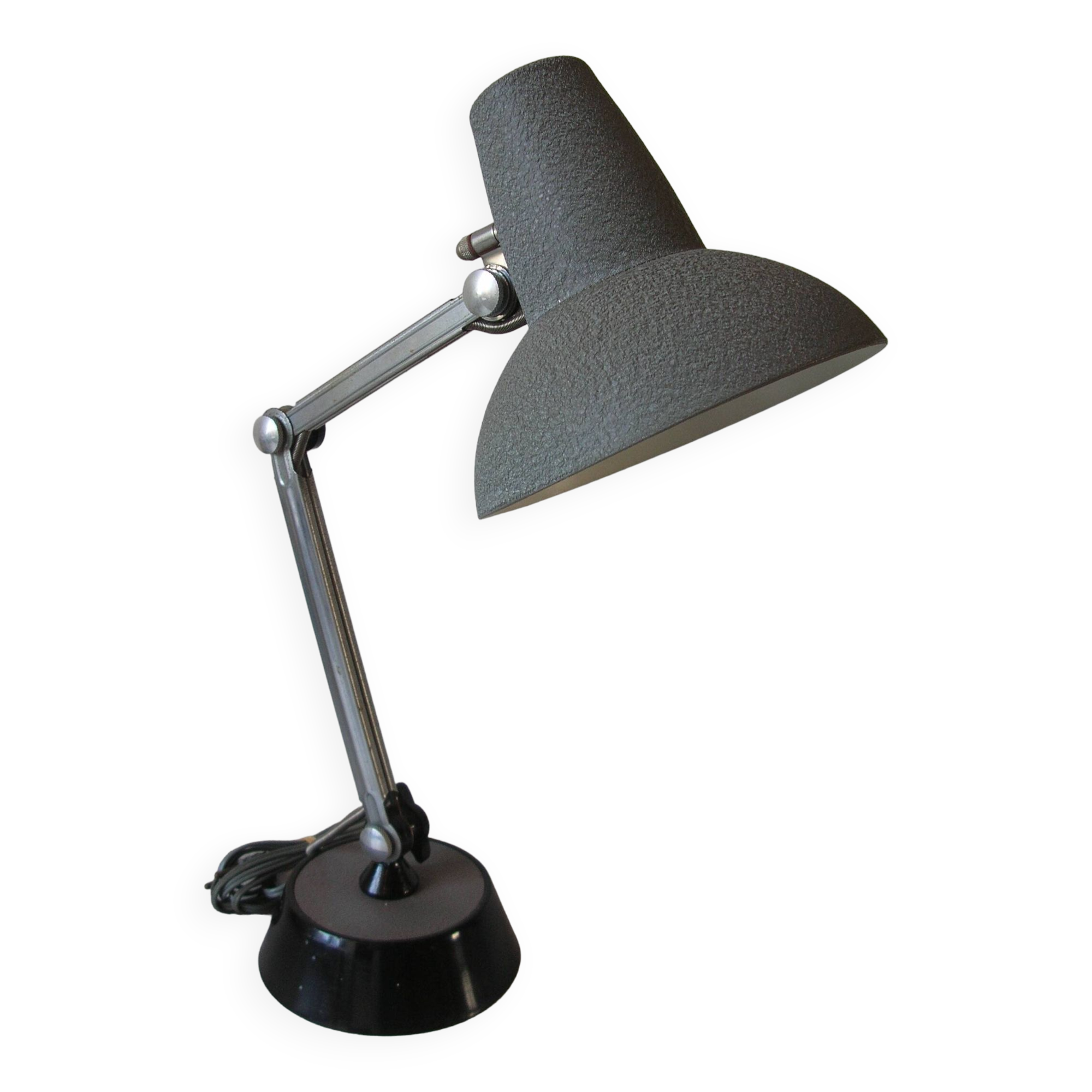 Super Chrome old articulated metal desk lamp on workshop decor base