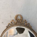 Louis XVI style gilded oval mirror