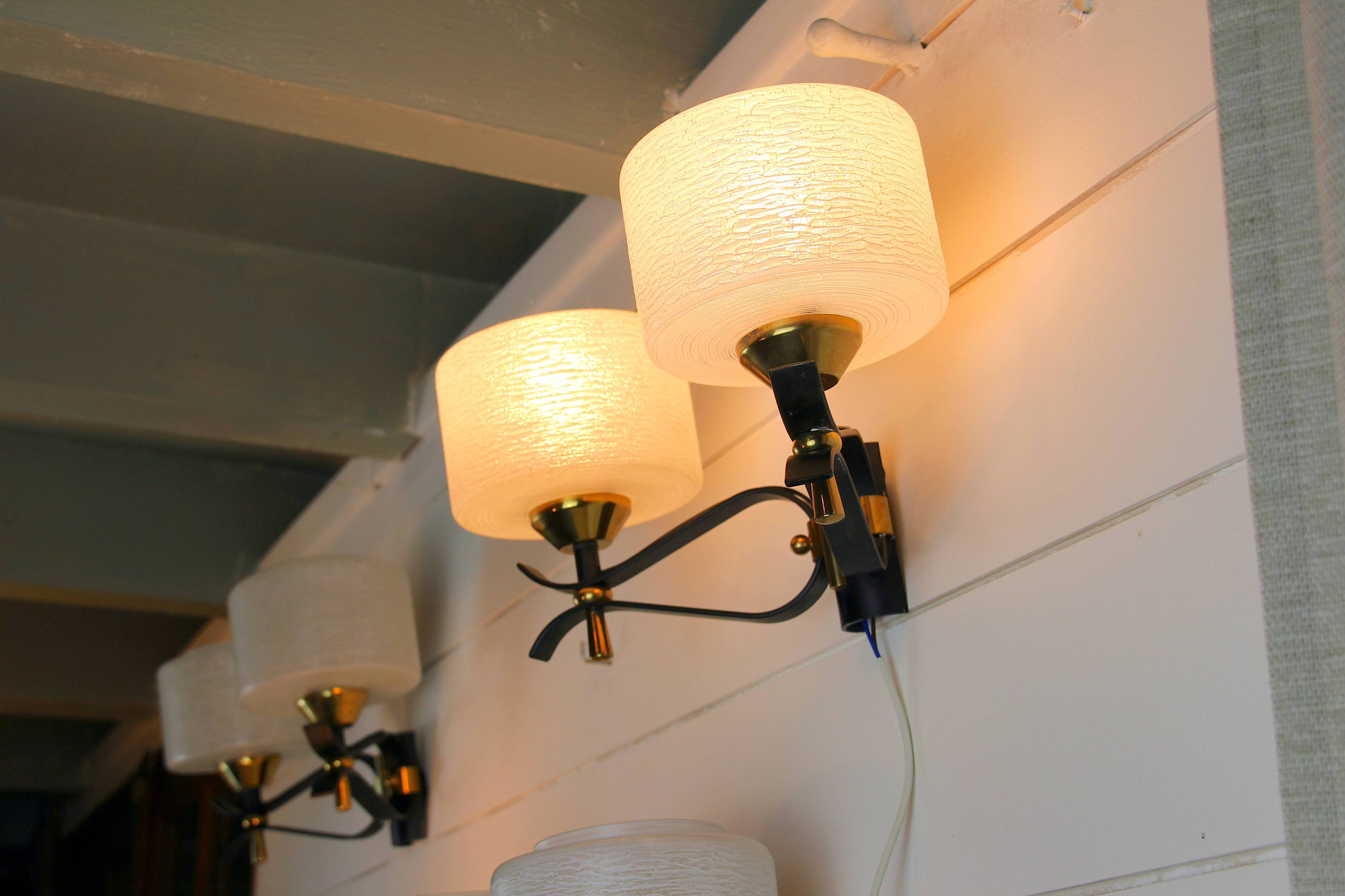 Pair of double wall sconces, Maison Arlus, Mid-Century, black brass opaline