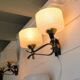Pair of double wall sconces, Maison Arlus, Mid-Century, black brass opaline