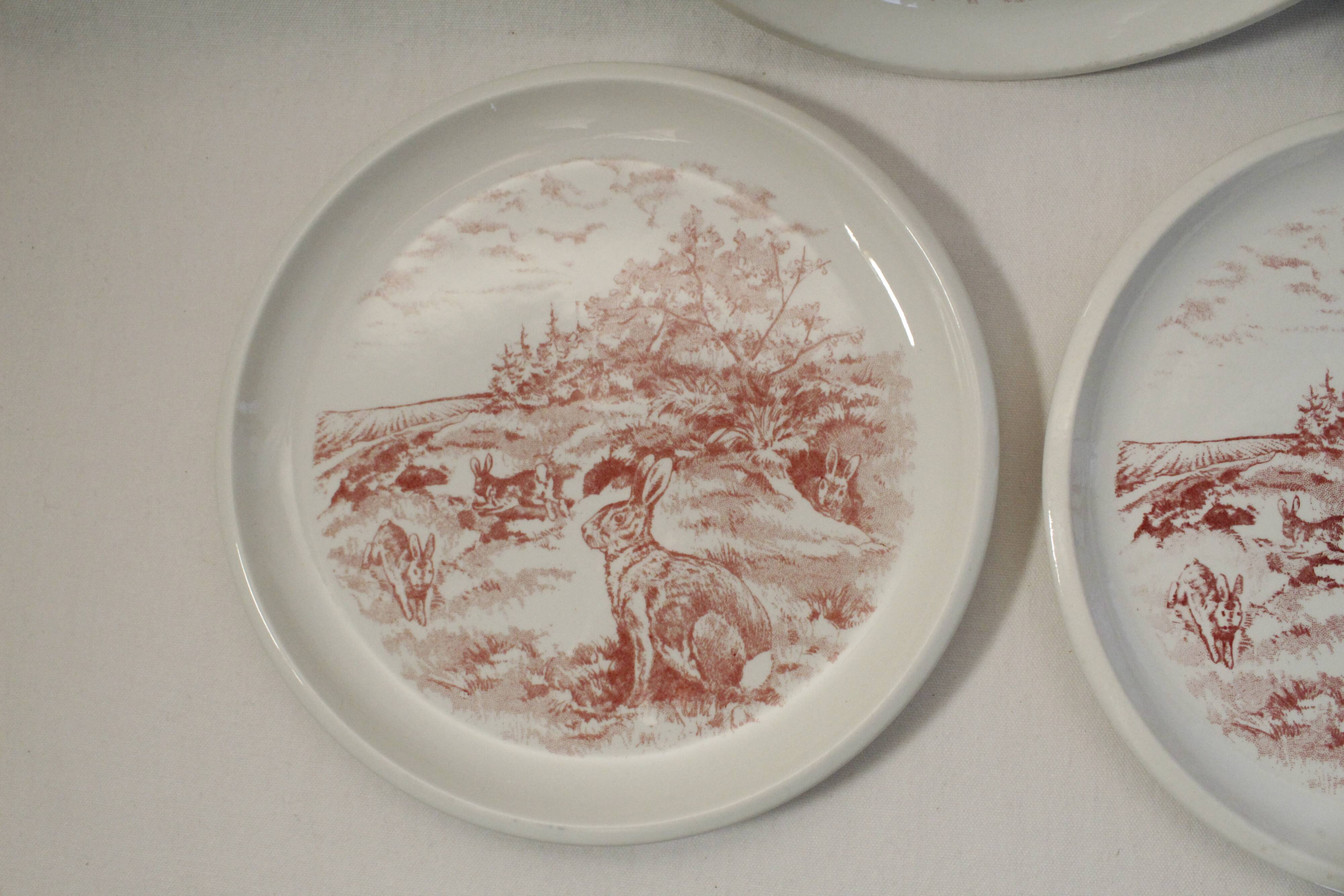 Set of 3 mismatched flat plates - red/burgundy decorations - deer and hare
