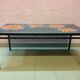 Vintage coffee table ceramic tray decorating orange flowers on grey background