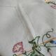 Antique linen tablecloth embroidered with flowers
