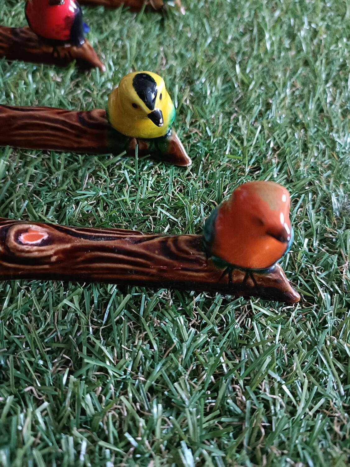 Set of six barbotine bird knife rests