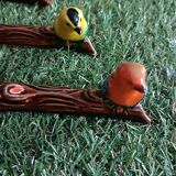 Set of six barbotine bird knife rests