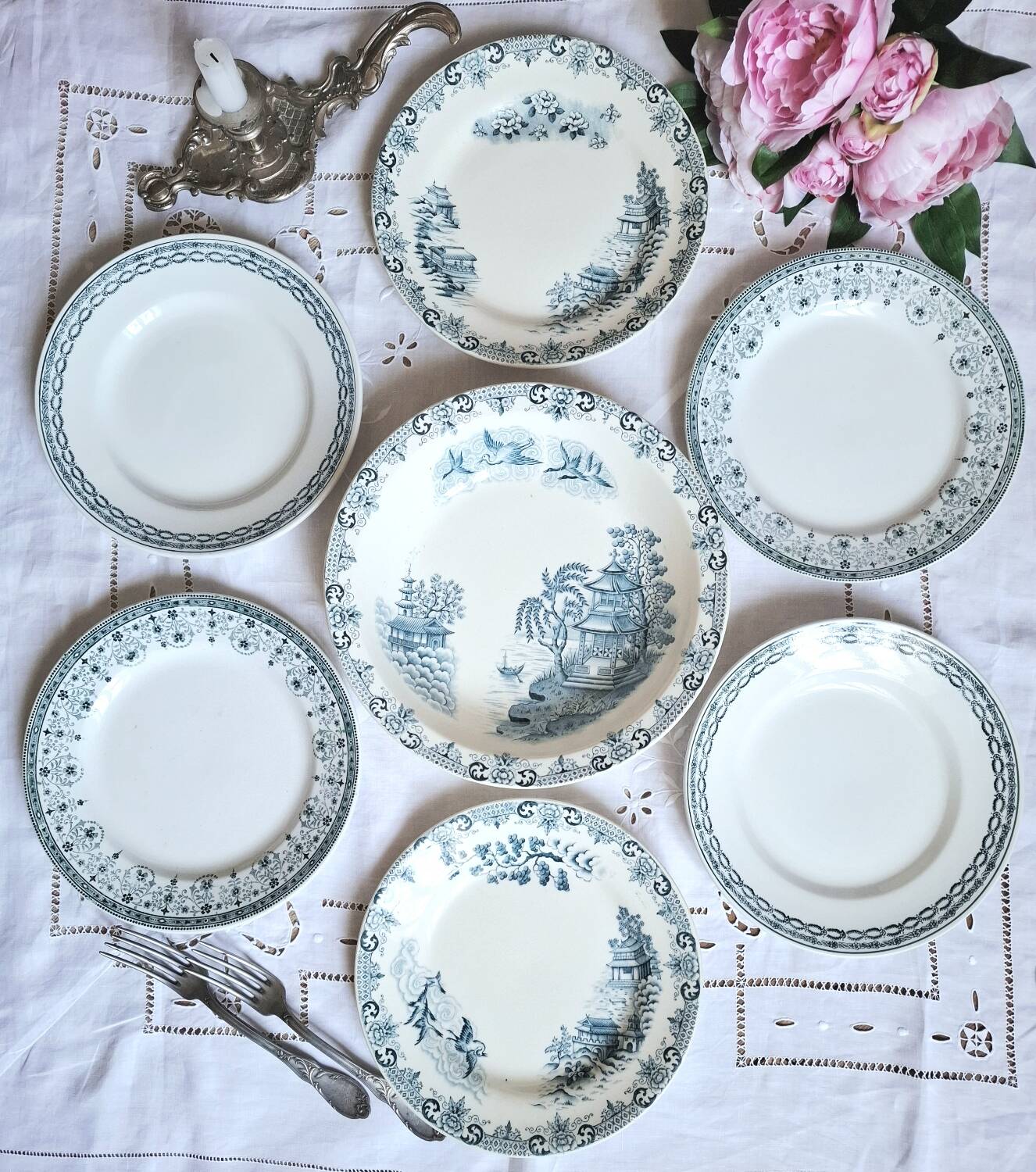 Mismatched antique flat plates made of ironstone accompanied by