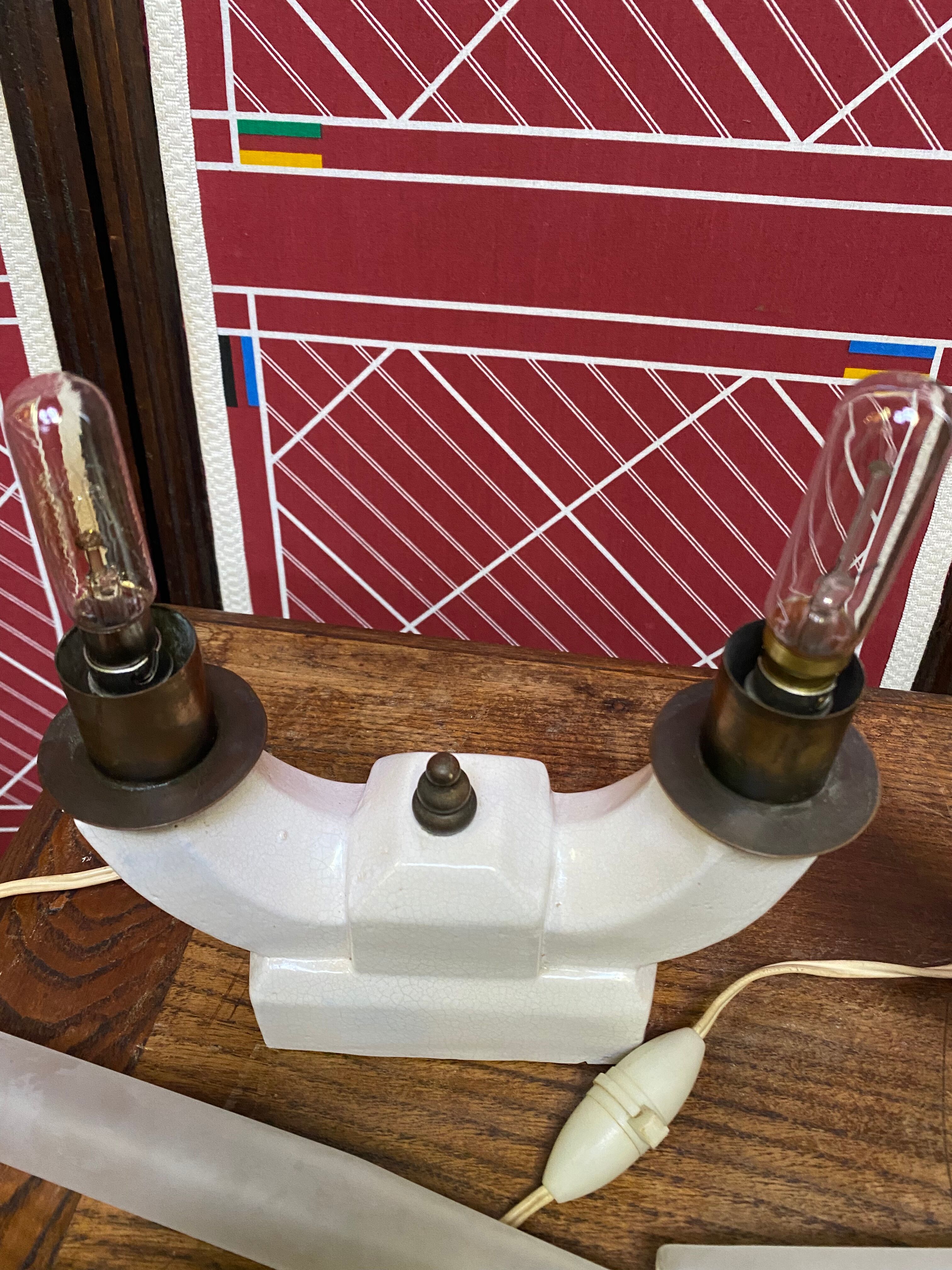 Pair of ceramic and brass office chandeliers