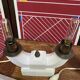 Pair of ceramic and brass office chandeliers