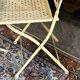 Foldable garden or terrace furniture set made of sheet metal and woven, perforated wrought iron, 5 pieces.