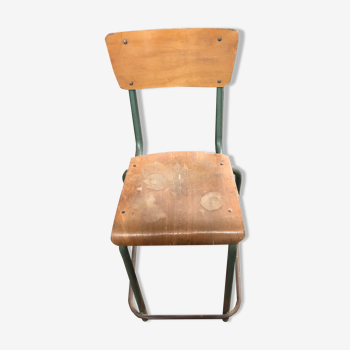 Old school chair rests metal feet