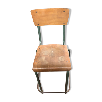 Old school chair rests metal feet