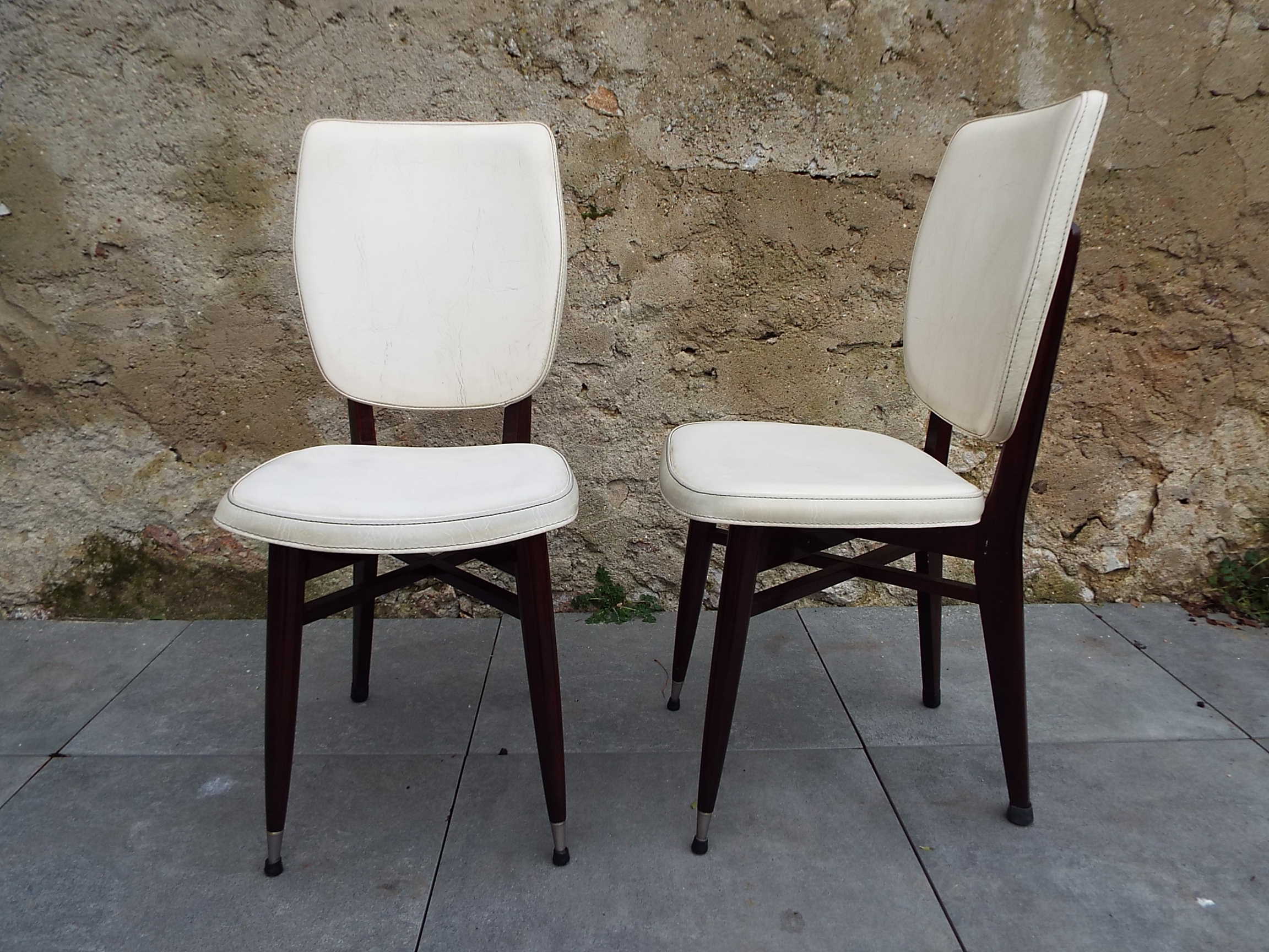 2 skai and wooden chairs