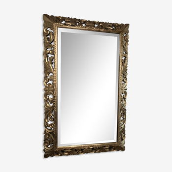 Golden mirror in carved wood beveled mirror