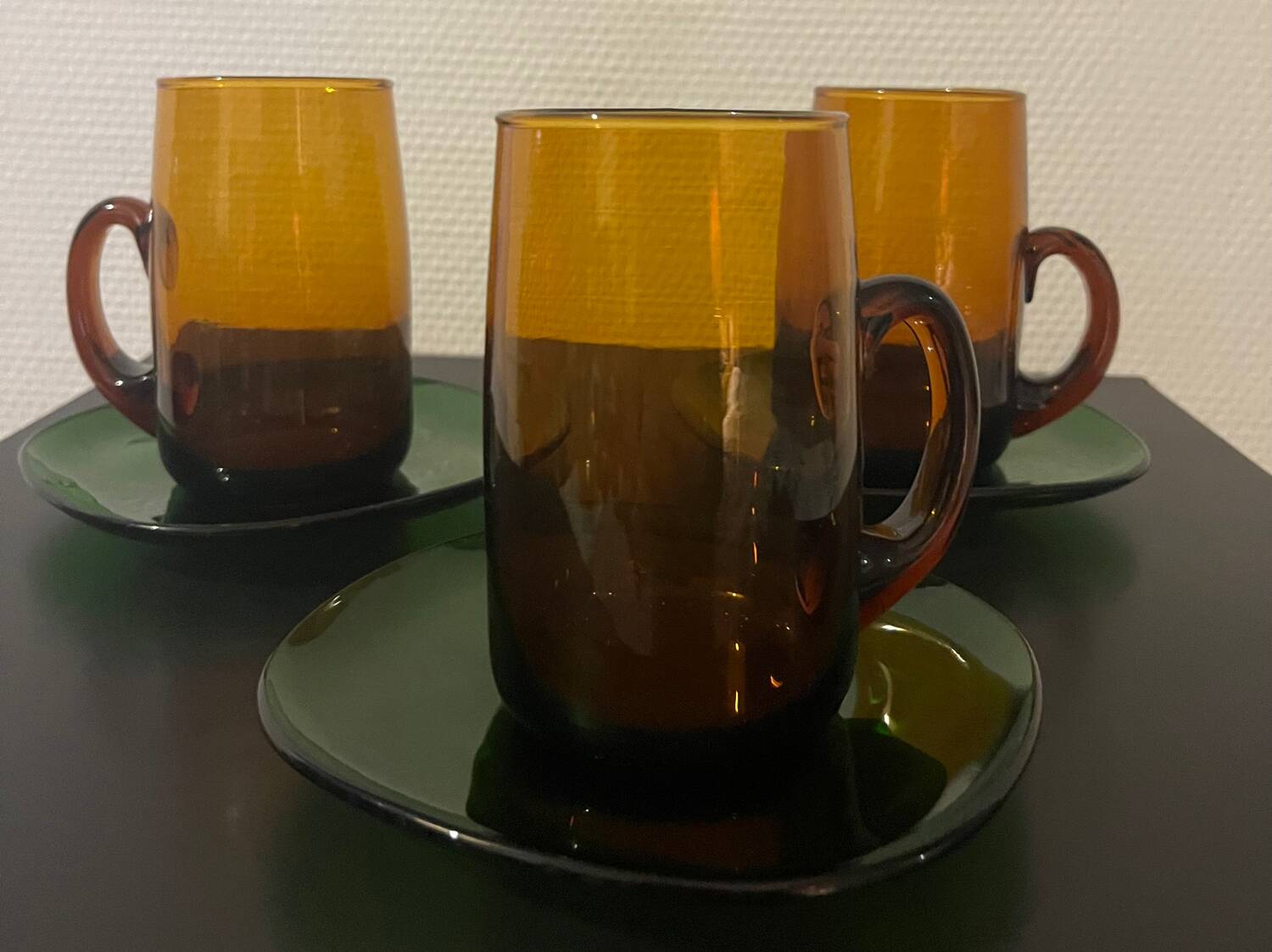 3 amber cups and green saucer