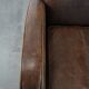 Elegant set of two sheepskin leather armchairs with beautiful round shapes