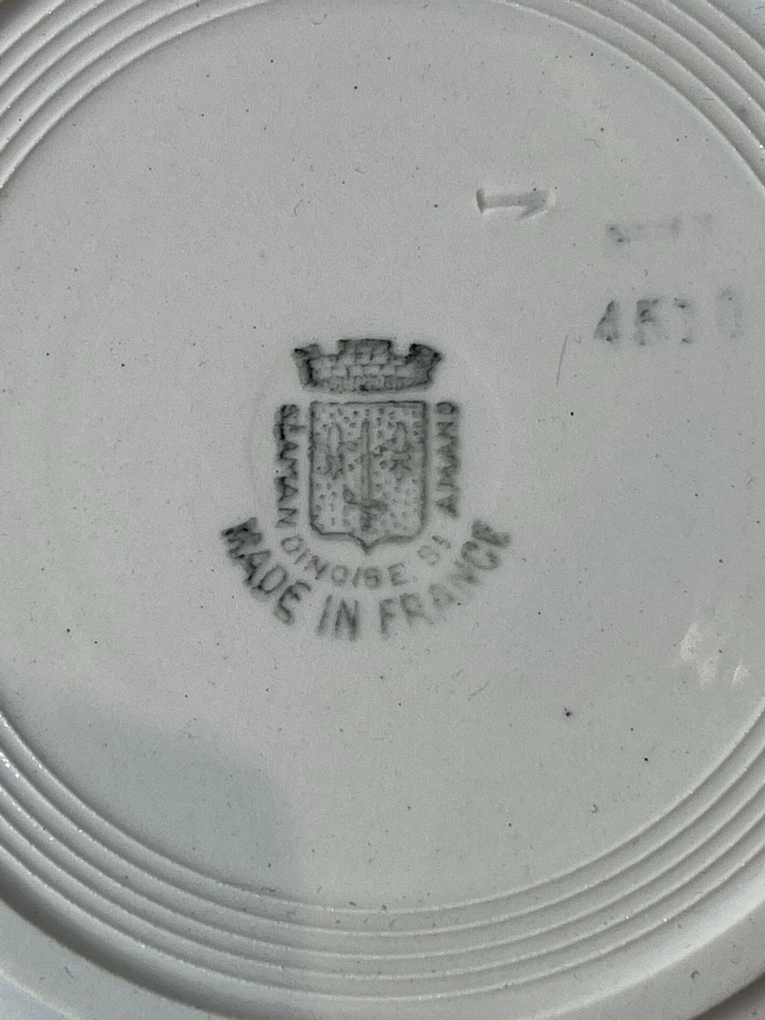 Set of 12 deep plates Saint Amand with floral garland decoration.