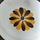 Set of three Italian deep plates from the 1970s, with ochre brown floral decoration.