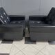 2 Black leather arm chairs 1960s on wheels
