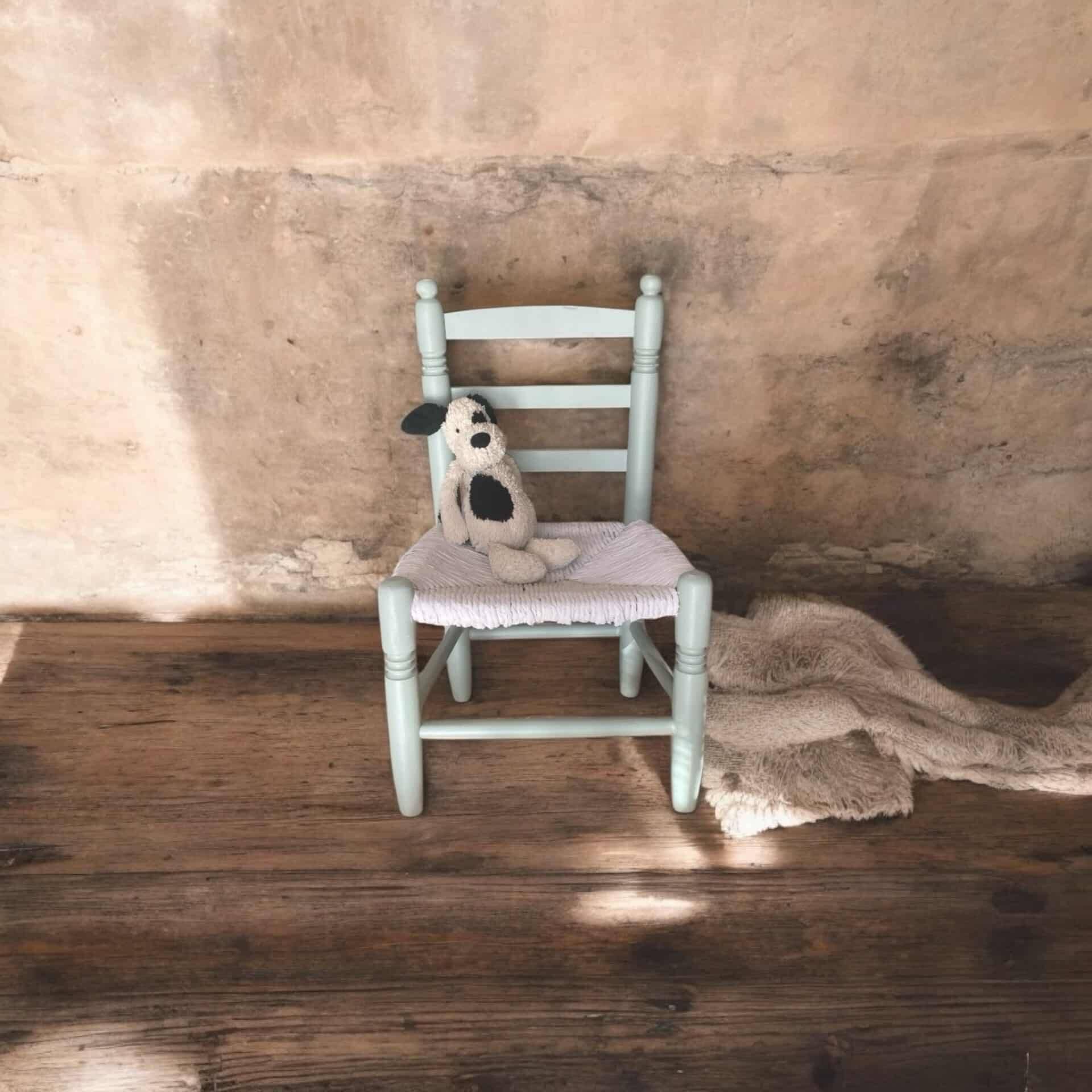 Child's chair in wood and straw revamped in almond green and white.