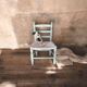 Child's chair in wood and straw revamped in almond green and white.